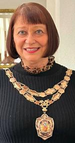 Photograph of Heather Fletcher wearing her chain of office as Deputy Ceremonial Mayor of Salford.