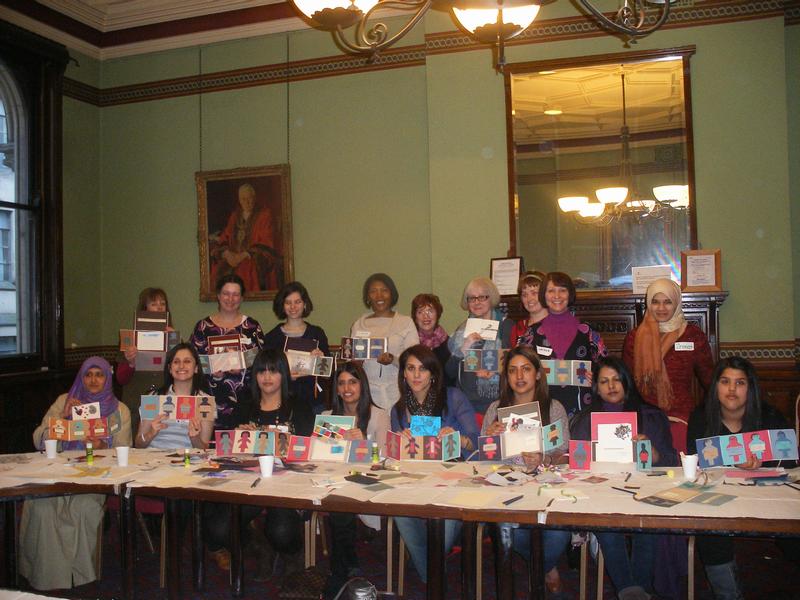 Photograph of participants at International Womens' Day showing their creations.